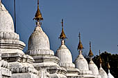 Myanmar - Mandalay, Kuthodaw Pagoda. 729 white pitaka pagodas contain the Tipitaka, the sacred texts of Theravada Buddhism. 